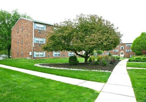 Walkway to residential buildings at Warrington Crossings apartments for rent in Warrington, PA